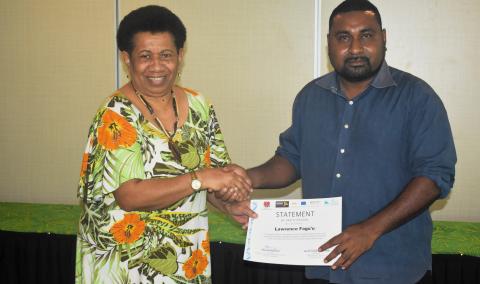Participants receiving certification for participation during the PNG ToT