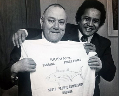 New Zealand Prime Minister (1975-1984) , Robert Muldoon, being presented with an SPC-SSAP t-shirt by SPC's Secretary-General (1979-1982), Vivian Young (Image: SPC Archives)