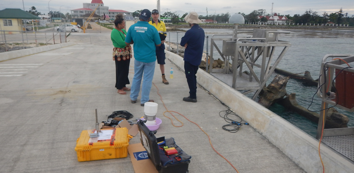 Siotasia Malolo and Viliami Folau of Tonga Lands and Survey inspect progress on the Tide Gauge and GNSS CORS installation with Bart Thomas (GA) and Adrian Lauranceau-Moineau (SPC)