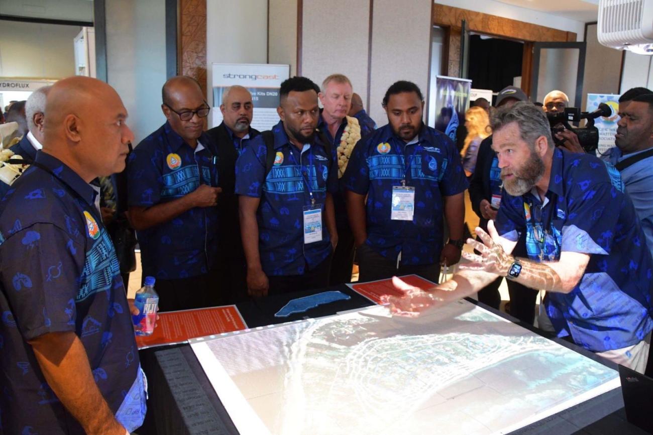 SPC's Peter Sinclair presents a 3D model on atoll security to Ministers at the 6th PWWM Forum
