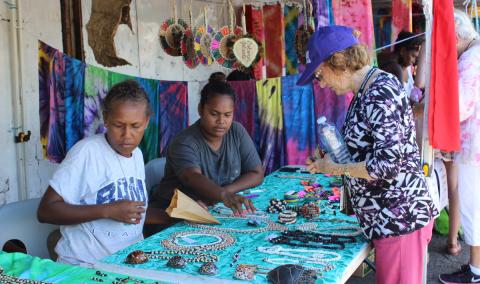 Youth selling local products to tourists in Honiara, Solomon Islands - Photo by Joey Manemaka