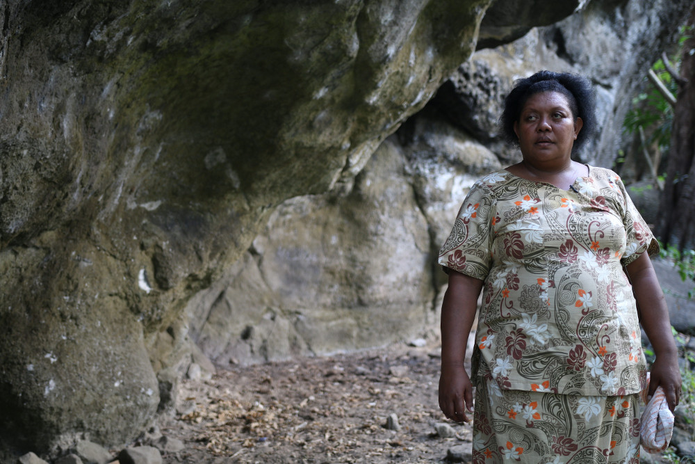 Vilimaina Ratu, Tukuraki village member, standing in front of the cave which sheltered her and her family from the brunt of Category Five Tropical Cyclone Winston